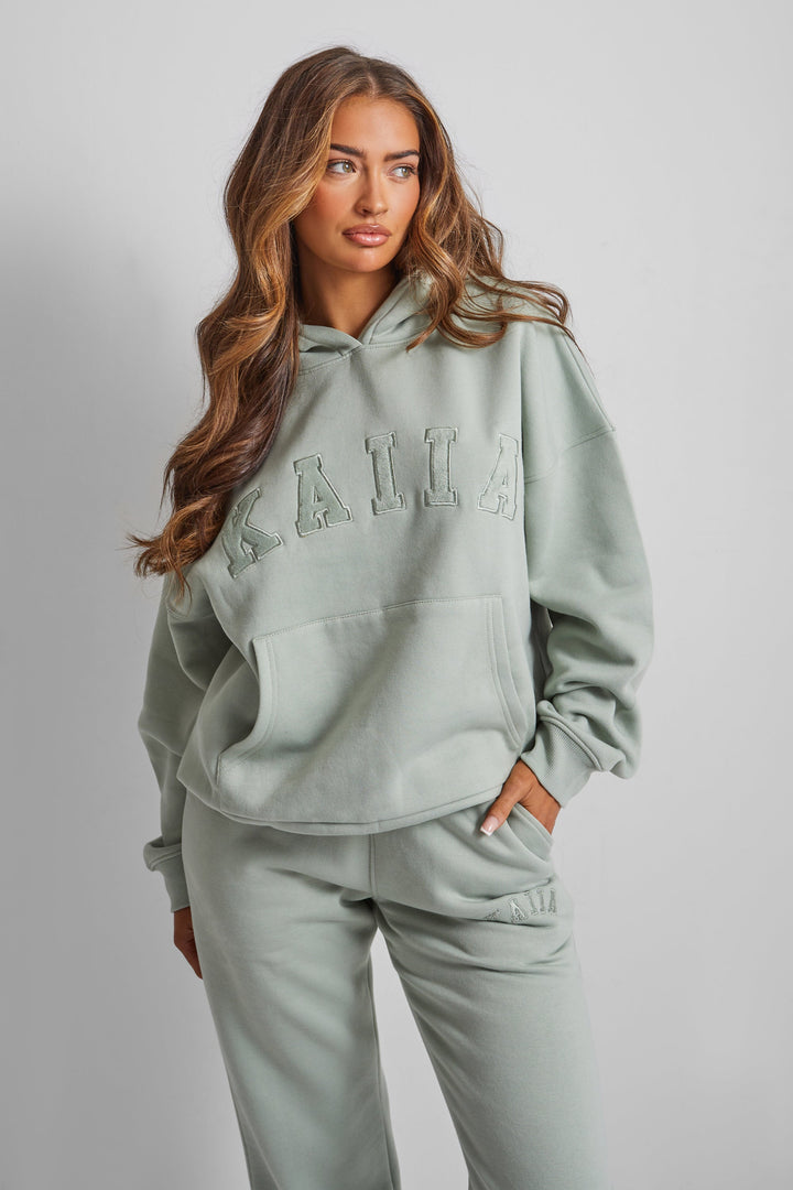 Kaiia Oversized Slogan Hoodie in Sage Green – Cozy and Stylish Loungewear