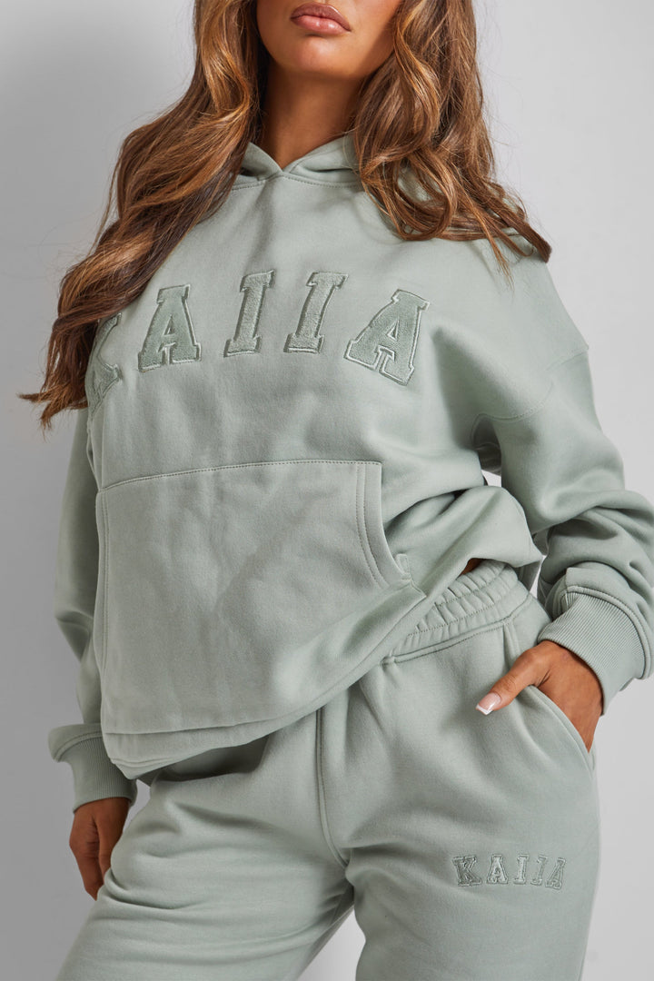 Kaiia Oversized Slogan Hoodie in Sage Green – Cozy and Stylish Loungewear